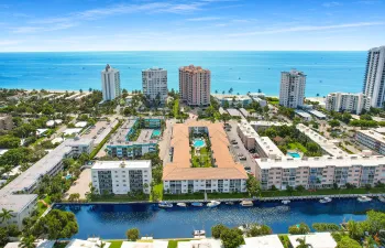 BEACH AND BOAT LOVERS DREAM LOCATION!.., FEATURING PRIVATE DEEDED BEACH ACCESS, COMMUNITY BOAT DOCK, NO FIXED BRIDGES, 1 CANAL FROM THE INTRACOASTAL WITH 6 BOAT SLIPS! Located in desirable North Leisure Gardens COMPLETELY REMODELED 2-bed, 2-bath, 1st floor, corner unit features EVERYTHING BRAND NEW!, a custom kitchen with quartz countertops, soft-close cabinets, stainless-steel appliances and ALL NEW, ELECTRIC, PLUMBING, HWH AND AC UNIT.