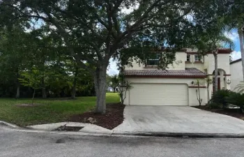 Front of house. 2 car garage and side yard