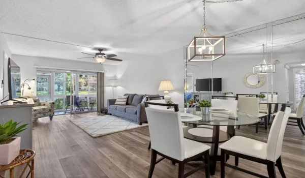Open dining and living room with lake view