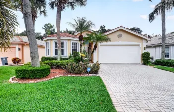 Lush Landscaping & curb appeal creating a warm & elegant welcome.