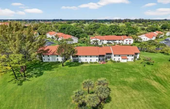 Enjoy expansive green space with mature trees and open views behind the residence.