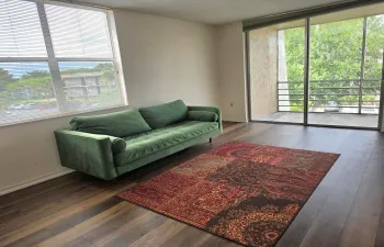 Living Room with Laminate Flooring and Plenty of Natural Light
