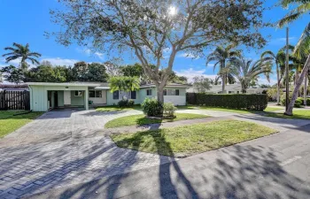 Welcome home to a charming front exterior with a spacious circular driveway