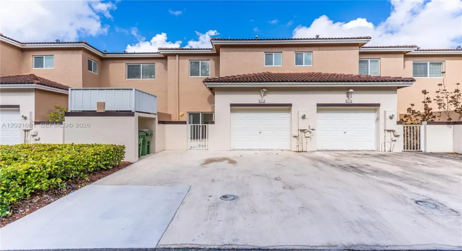 Rear entrance featuring the garage.