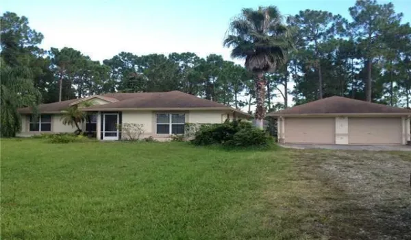 Great location on PAVEMENT, large fenced backyard. One lot off Coconut and 68th