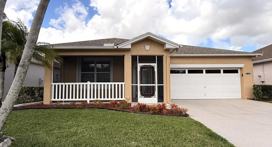 RARE Waterfront Home with a 2-car garage in the gated community of Kings Isle.