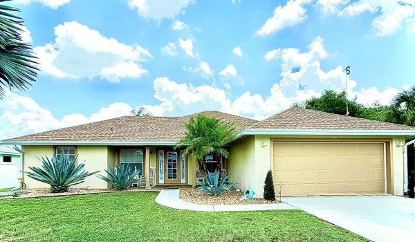 Beautiful 3 BR, 2 BA Rancher on .44 acre. Features vaulted ceilings, 2 master suites, custom coffee bar, quartz counter tops, tiled flooring, screened & heated in-ground pool, spacious lanai, private fenced back yard and 2 car garage, Many unique additions and quality upgrades. Must See!