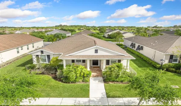 Aerial View front exterior with a spacious porch, perfect for relaxing