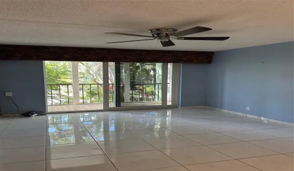 View of tranquil balcony from living room, dining room and kitchen