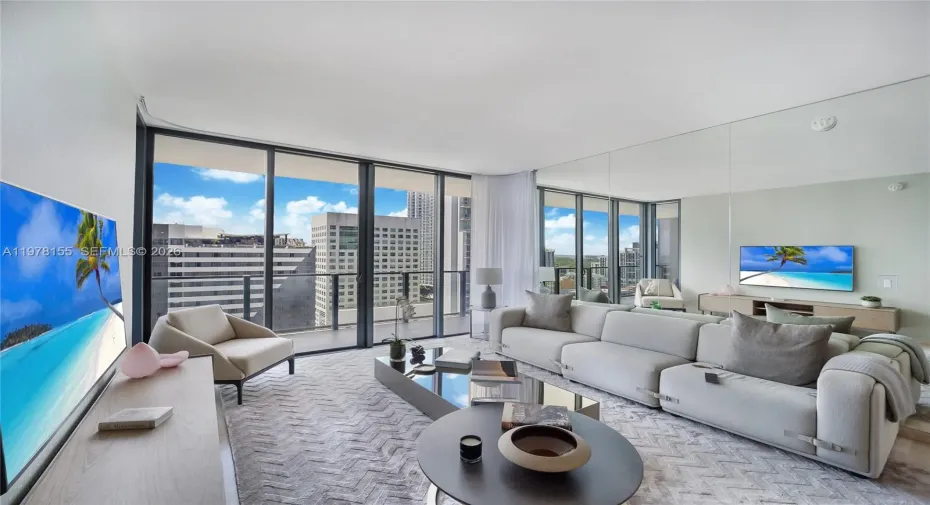 Living Room. Custom mirror wall, reflecting light and expanding views from all angles.