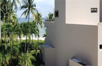 Sit on your balcony and enjoy a peek of the ocean and a short walk to the beach.