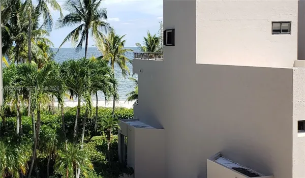 Sit on your balcony and enjoy a peek of the ocean and a short walk to the beach.