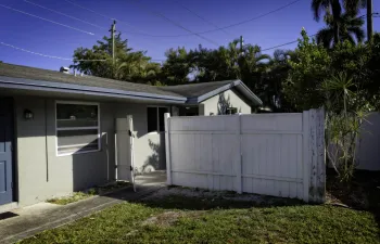 Entrance to end unit with Private Fenced Yard