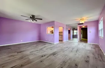 Corner 1/1.5 Condo in 55+ Century Village! Featuring Impact Windows, Updated Tile Flooring in Living Area, Stepin Shower in Full Bath, and Recently Updated Lanai Enclosure