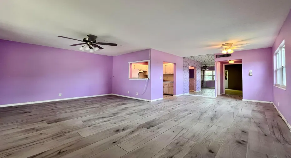 Corner 1/1.5 Condo in 55+ Century Village! Featuring Impact Windows, Updated Tile Flooring in Living Area, Stepin Shower in Full Bath, and Recently Updated Lanai Enclosure