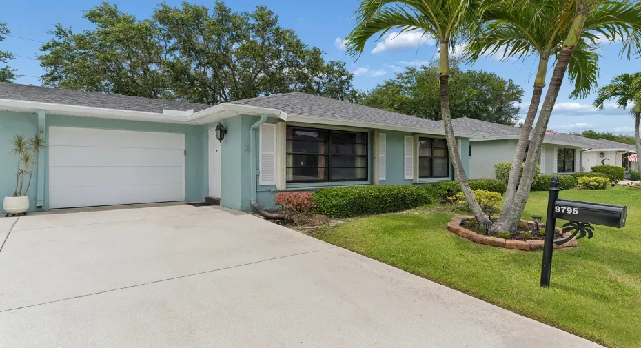 Lovely 2Br/2BA tiled villa with garage and NEW ROOF 2026. Vacant for quick close. Great elevation