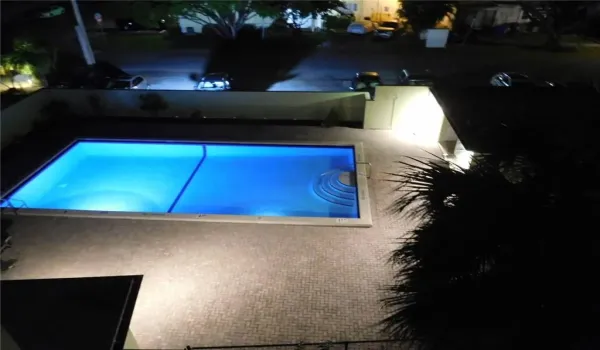 Pool view at night from unit