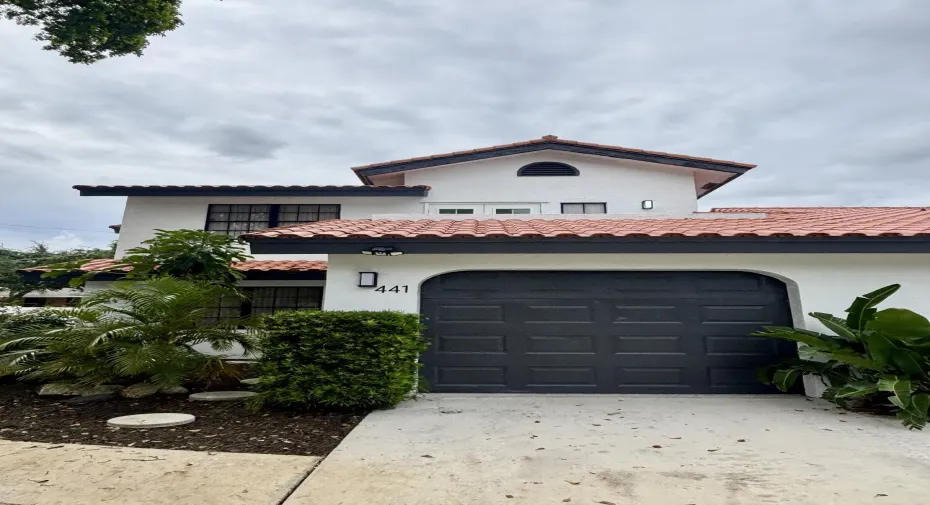 Front of Property. One car garage with additional driveway parking for 2 cars.