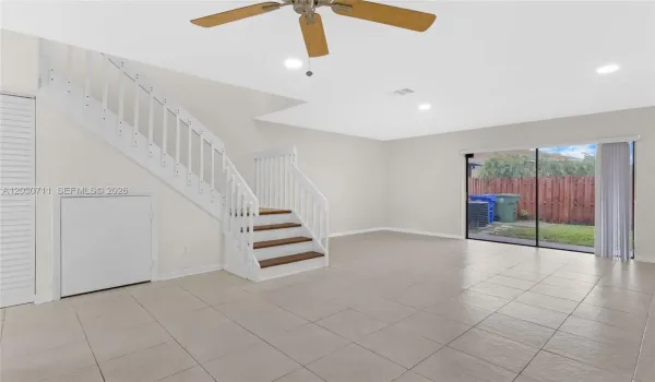 Living space freshly painted and new recessed lighting