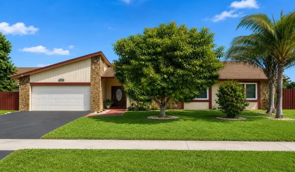 Street-facing exterior view of the 3-bedroom, 2-bath single-family home at 8330 NW 54th St in Lauderhill, Florida.