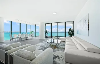 Direct ocean views from the spacious living area with floor-to-ceiling glass.