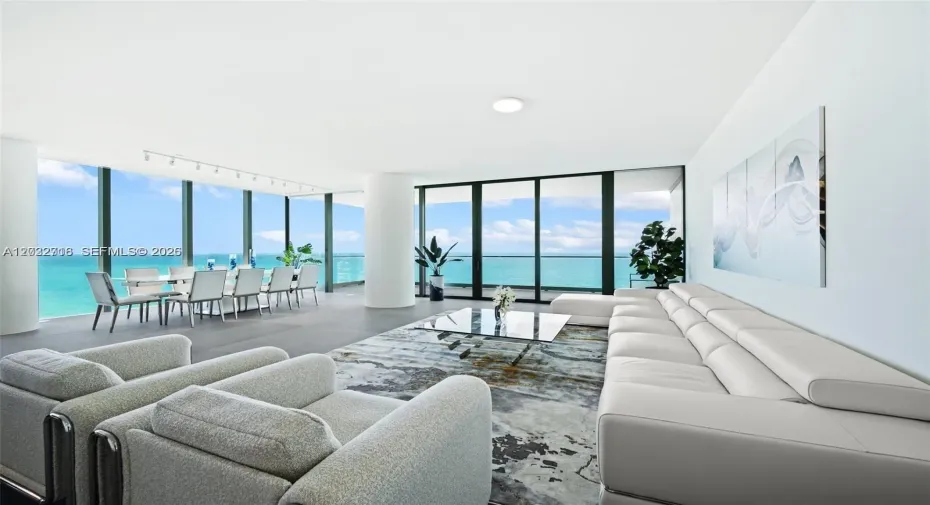 Direct ocean views from the spacious living area with floor-to-ceiling glass.