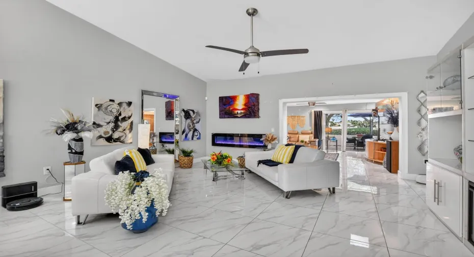 WOW, gorgeous porcelain tile! Living room with soaring 12' ceiling provides tons of natural light!