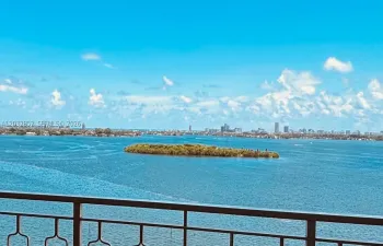 Rare opportunity to enjoy unobstructed bay views with a private island directly in front of your residence, creating a truly exclusive waterfront setting