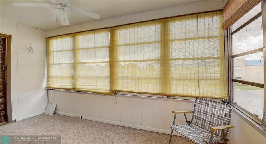 Sunroom with full size washer/dryer in closet