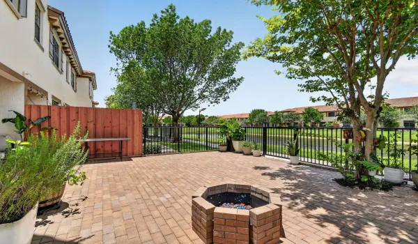 LARGE LAKEFRONT FENCED PAVER PATIO & FIRE PIT
