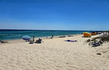 Live the sunsational beach life! Walk or bike to beach, just 1 block away from your new home.