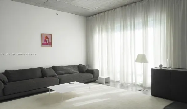 Bright and cozy living room - furnished with high-end design pieces.