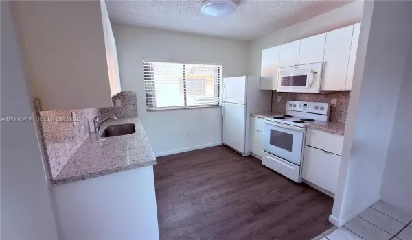 Open kitchen oversees the living and dining room