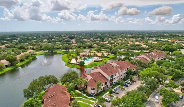 Exceptional lakefront location and a front-row view of the community pool and spa/hot tub in sought-after Fountain Springs