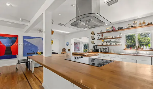 Completely remodeled featuring an open-concept kitchen that flows seamlessly into the living area, highlighted by a beautiful wood countertop.