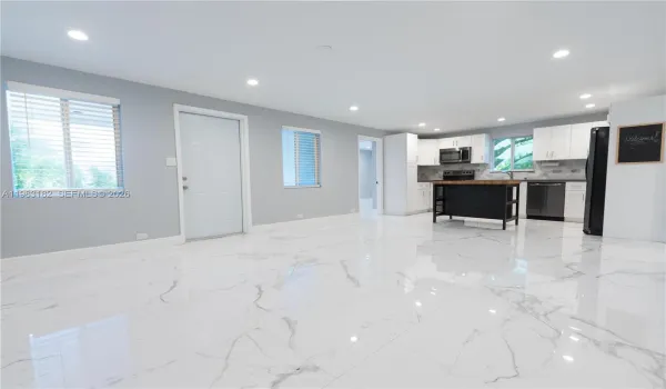 Bright open kitchen, dining, and living area perfect for entertaining.