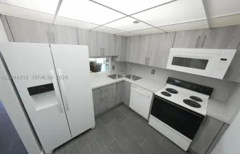 Brand new refrigerator.  Room for small breakfast table.