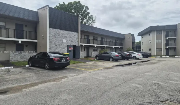 Welcome to Building 6 at Versailles Gardens, featuring assigned resident parking right at your front entrance