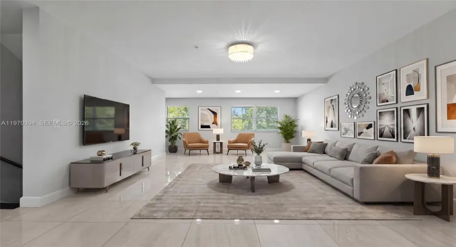 Staged to showcase the open living area — an ideal, gallery-like setting perfect for displaying art and entertaining in refined style.