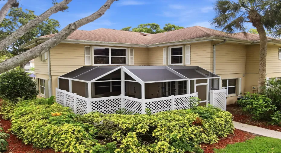 Beautiful two-story townhome with a screened patio, mature landscaping, and a prime location within the community.