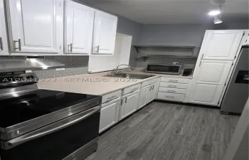 TOTALLY REMODELED KITCHEN WITH SS APPLIANCES & EXTRA PANTRY