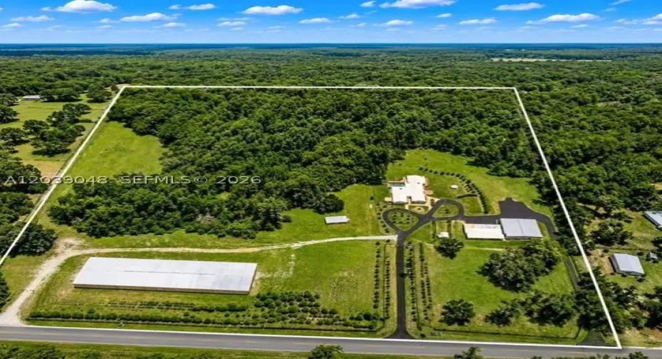 A rare automotive paradise featuring over 100-car capacity across multiple professional-grade structures. From the dedicated paint booth and expansive garage space to the massive commercial facility, this estate offers unmatched opportunities for collectors, enthusiasts, and business owners alike.