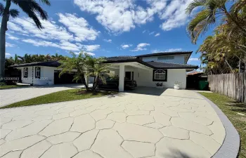 Right side of driveway and home