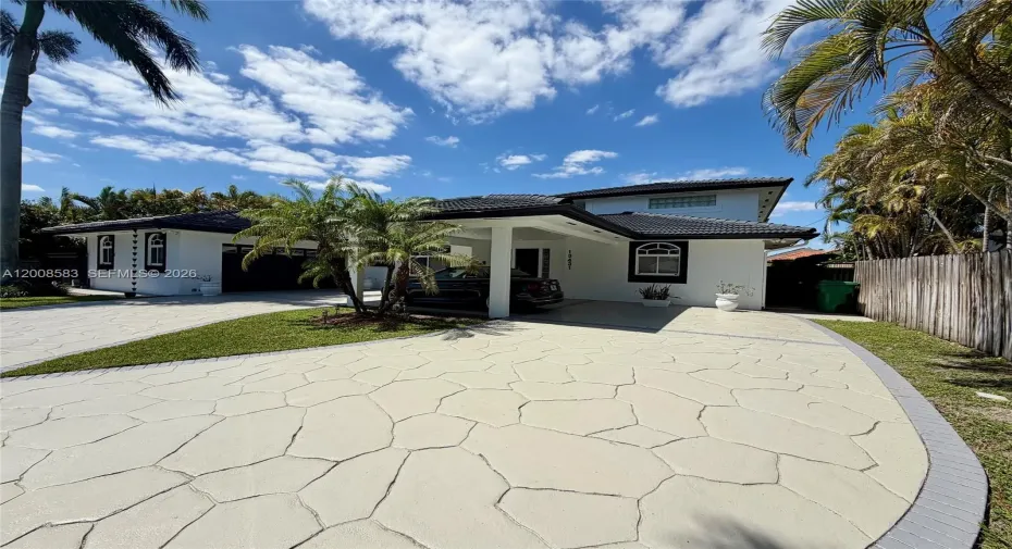 Right side of driveway and home