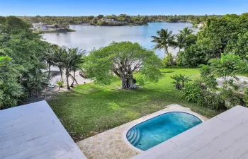 Beautiful garden with pool and lake views