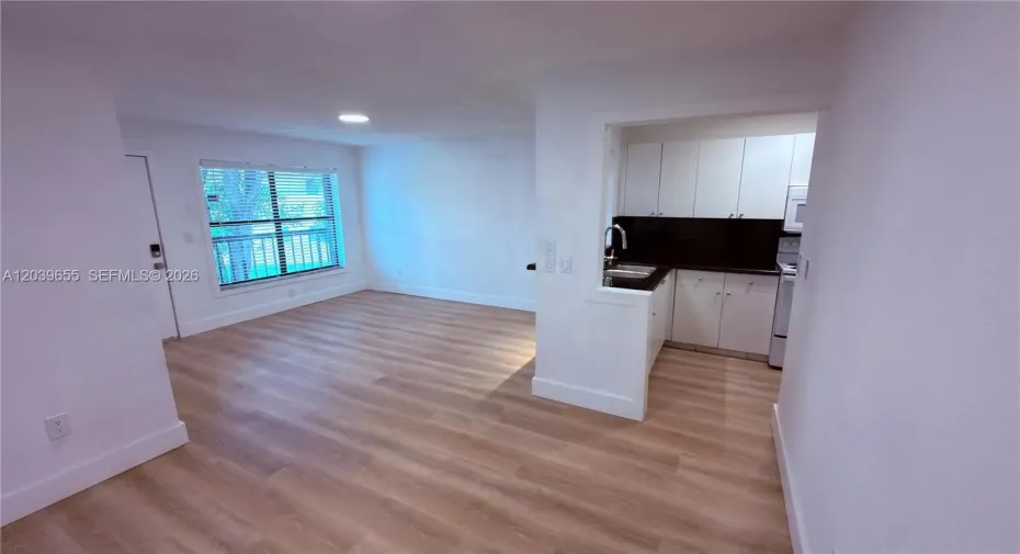 Look at the ample space created by this newly installed flooring!
