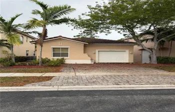 This photo shows the 1-car garage and 2-car front driveway.