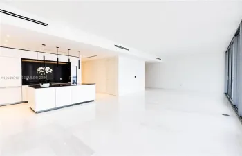 Spacious Living/Dining - Custom Kitchen - an open chef’s kitchen with custom Bulthaup cabinetry and top-of-the-line Gaggenau appliances is complemented by solid-core Bertolotto doors and imported Thassos marble flooring from Greece.