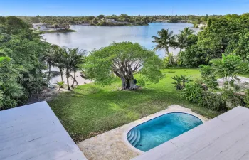 Beautiful garden with pool and lake views