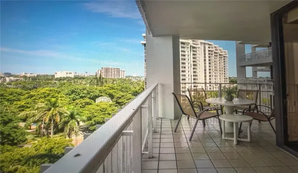 expansive balcony with views of city and bay.